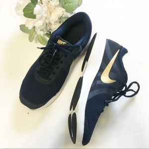navy blue and gold nike shoes